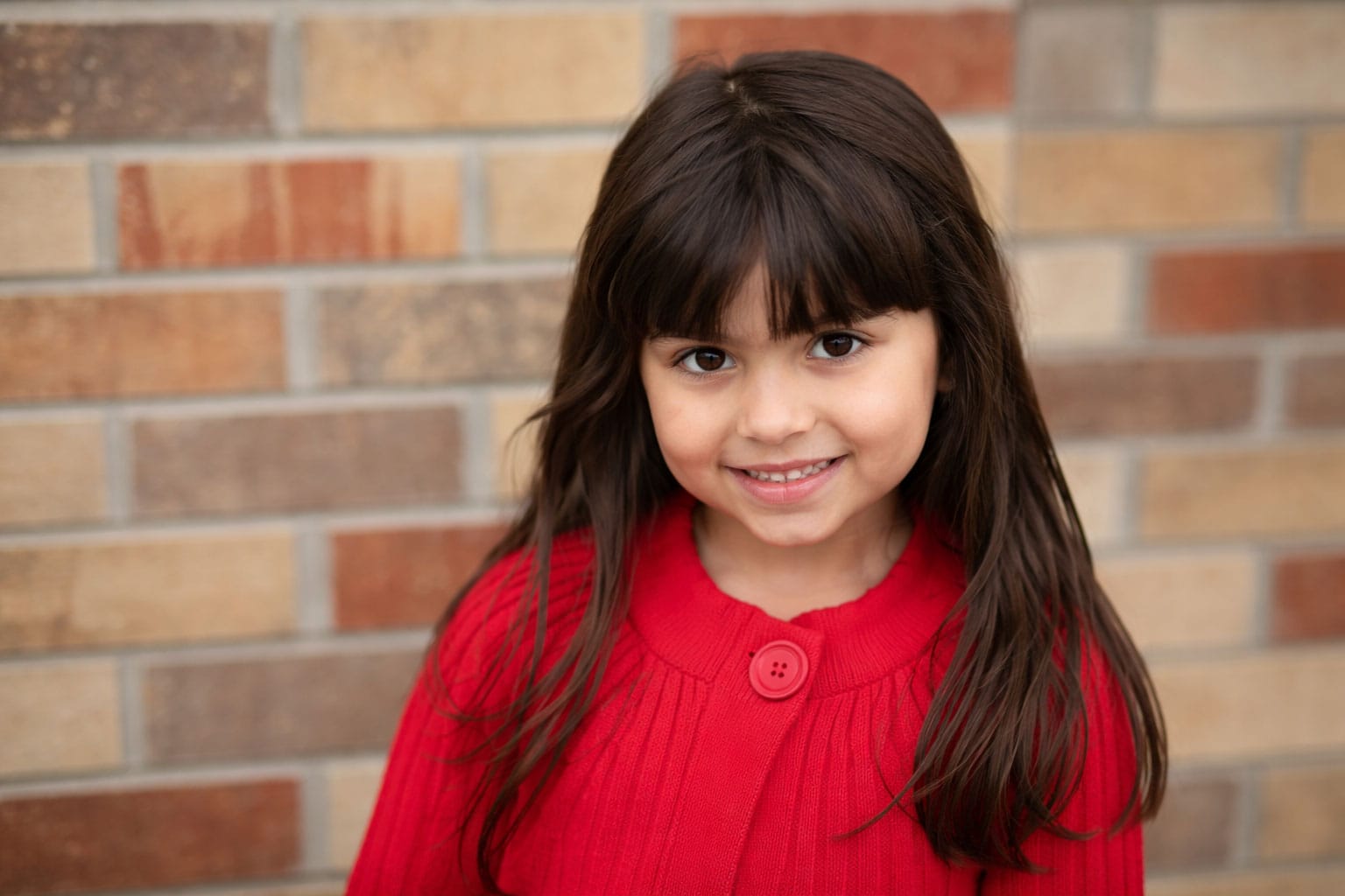 Bright smile against a vibrant wall