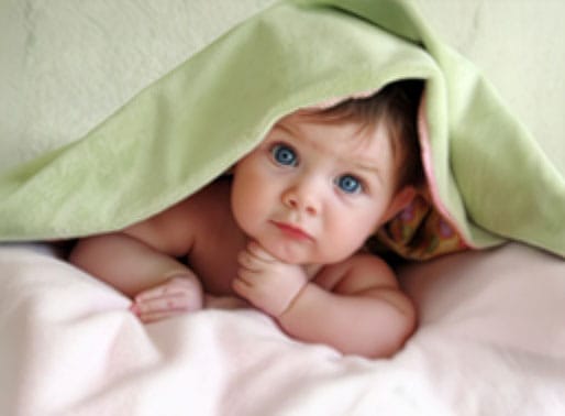 Baby under a blanket